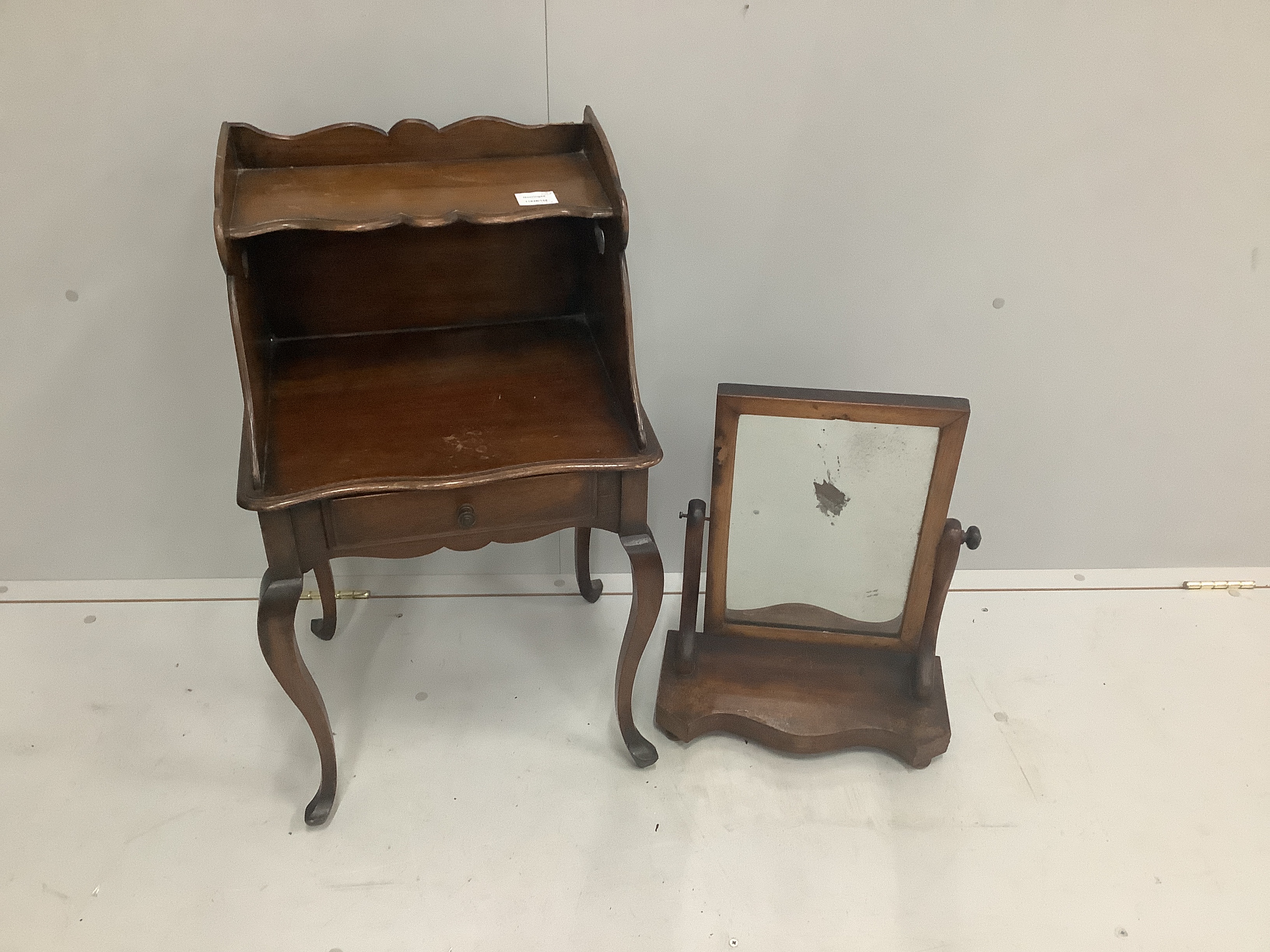 A two tier mahogany bedside table with single drawer, width 43cm, depth 36cm, height 74cm together with a Victorian serpentine mahogany toilet mirror